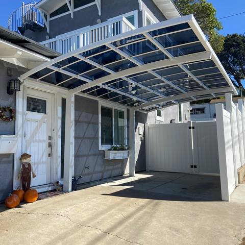 single-car-cantilever-next-to-house-white-blue