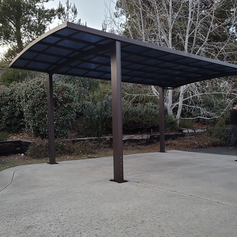 single-tall-driveway-cover-free-standing-brown-gutters-2